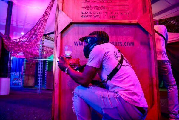 man firing gel blaster
